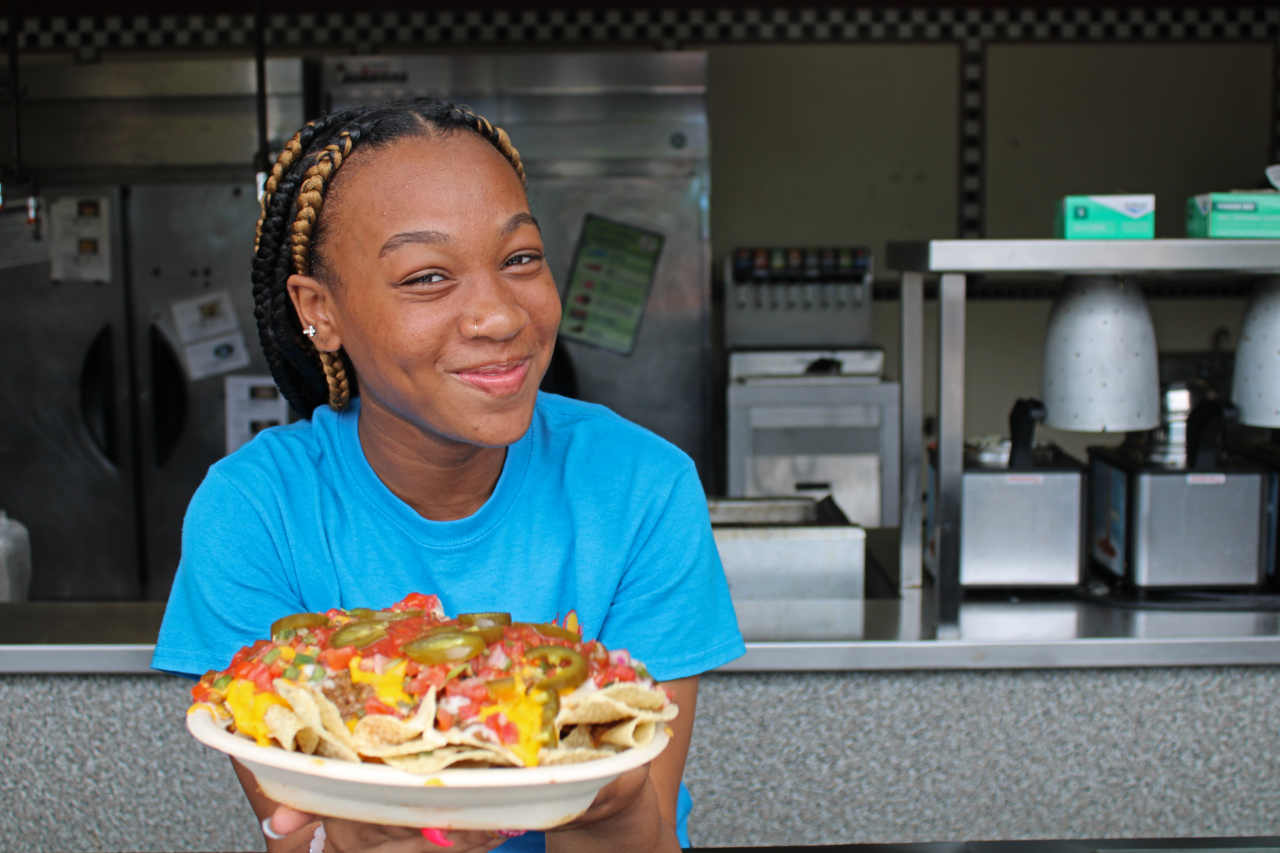 Woman holding nacho plate